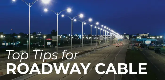 Highway with roadway lights illuminating the street